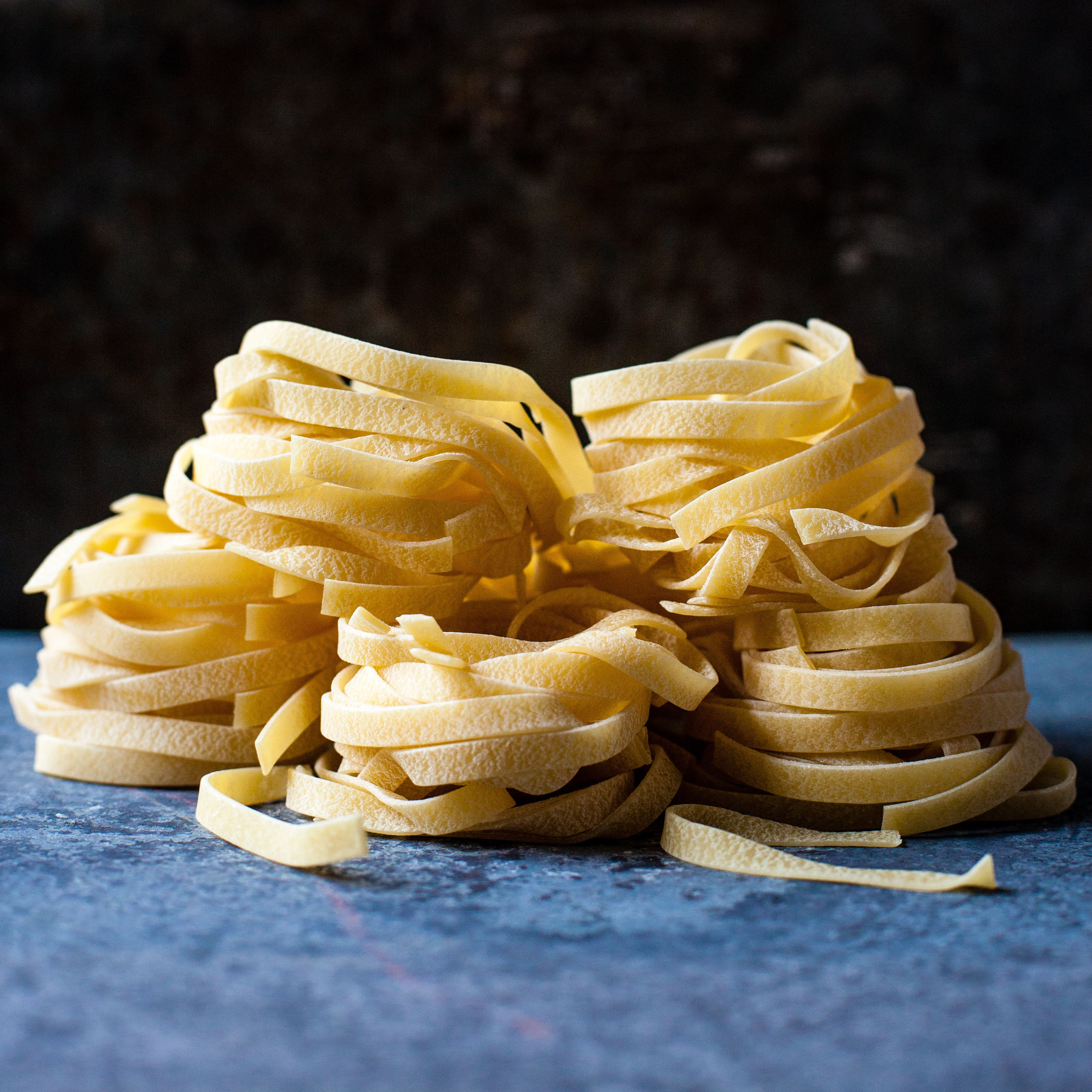 A picture of a pile of fresh pasta. The image was obtained from Unsplash at https://unsplash.com/photos/zmBI_GT_xps